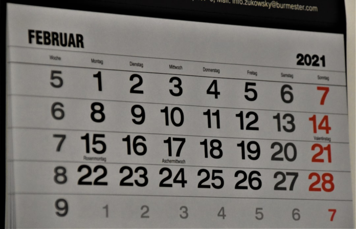 February 2021 calendar page clearly displaying dates and days, symbolizing efficient organization and time management for streamlined appointment scheduling.
