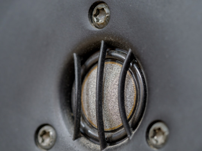 Detailed view of a speaker tweeter, its intricate design and protective mesh embodying the precise, high-fidelity communication powered by seamless ESP and CRM integration in marketing automation.